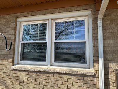 coal valley window replacement - outside view of larger side-by-side white-framed window, before
