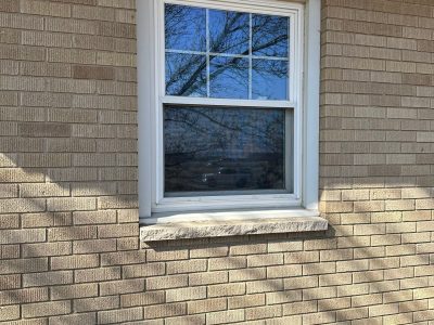coal valley window replacement - outside view of one white-framed window, before