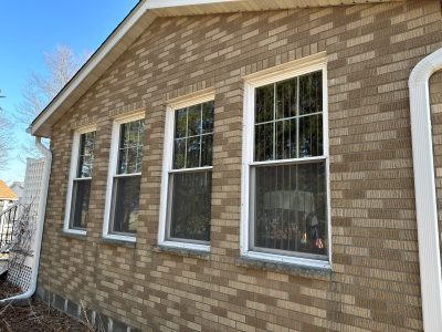 coal valley window replacement - outside view of house with four white-framed windows, before