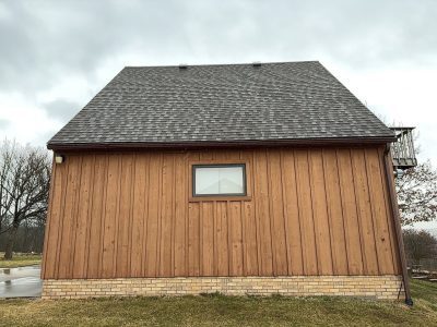milan siding replacement - side of brown garage, before