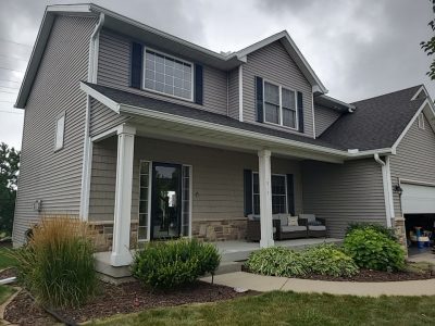 davenport roofing installation - street view of house with new roof, after