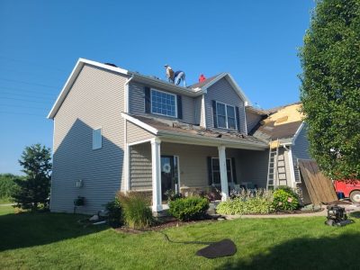 davenport roofing installation - street view of house, during