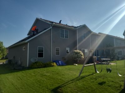 davenport roofing installation - backyard view of house, during