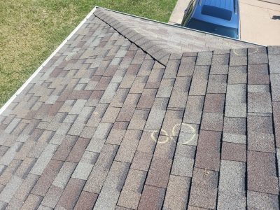 davenport roofing replacement - damaged roof shingles near peak, before