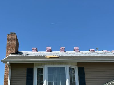 davenport roofing replacement - workers installing new roof layer, during