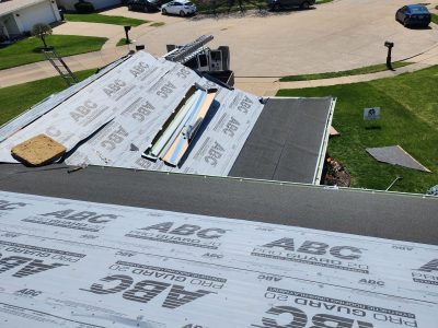 davenport roofing replacement - workers installing new roof layers, during