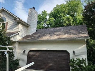 moline roofing replacement - garage of two-story house with new roof, after