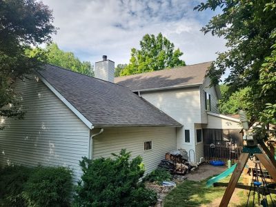 moline roofing replacement - side view of two-story house with new roof, after