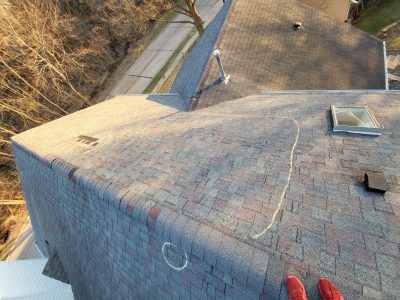 moline roofing replacement - bad spots circled on roof peak, before