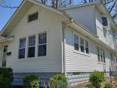 rock island roofing replacement - side of house with new roof and siding, after