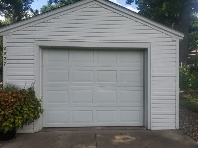 rock island roofing replacement - garage of white ranch-style house, before