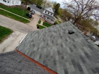 cambridge roofing replacement - corner of house with damaged roof tiles, before