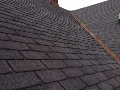 cambridge roofing replacement - side of house with damaged roof tiles, before