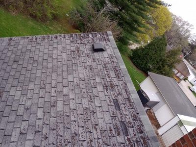 cambridge roofing replacement - aerial view of roof of yellow two-story house, before