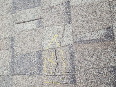 davenport roofing replacement - dented roof shingles, before