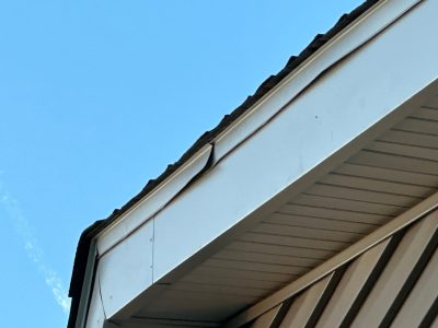 aledo roofing installation - cracked piece of roof, before