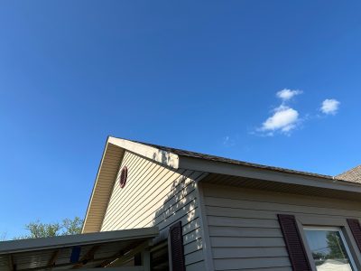 milan roofing installation - peak view of project house with new roof, after