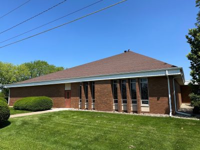 silvis roofing installation - street view side of old church roof, before