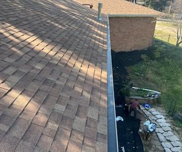 east moline roofing installation - long corner of house with new roof, after