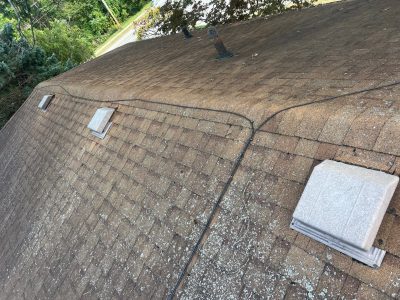 east moline roofing installation - side of old roof with bad weather damage, before