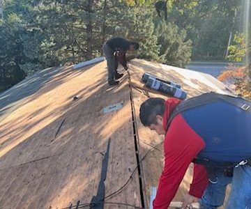 east moline roofing installation - workers prepping for new roof, during