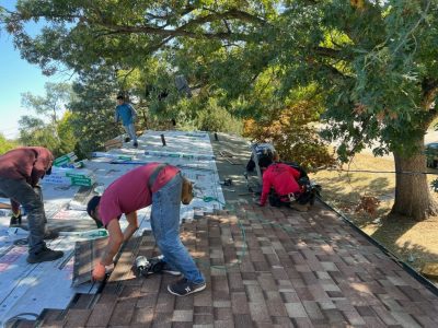 east moline roofing installation - workers removing old damaged roof, during