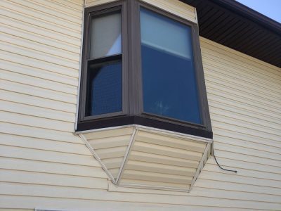 blue grass window replacement - outside view of second-story bay window with dark brown trim, before - 2
