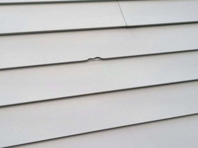 davenport siding installation - old broken tan siding, before - 2