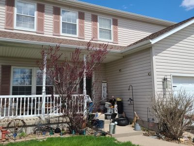 new liberty window replacement - front view of two-story house, before