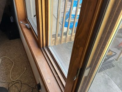 swisher window installation - inside corner of old brown window frame, before