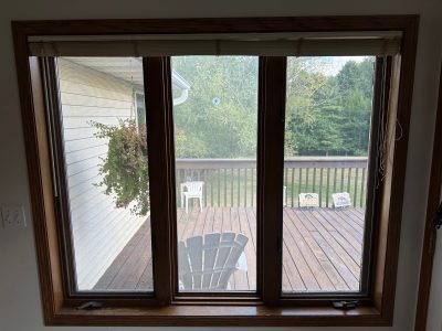 swisher window installation - inside view of three long patio/kitchen windows, before
