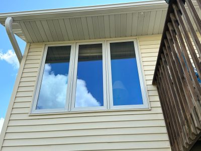 swisher window installation - exterior view of three long patio/kitchen windows, before