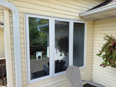 swisher window installation - outside view of three long patio/kitchen windows, before
