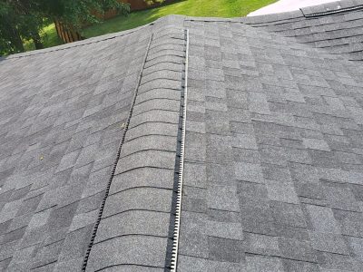 orion roofing replacement - new gray roof peak, after