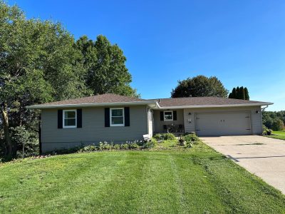 orion roofing replacement - street view of large two-story house, before
