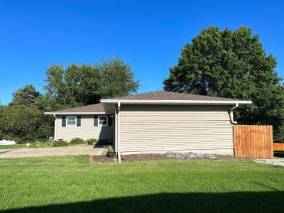 orion roofing replacement - side view of large two-story house, before