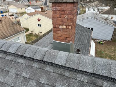 moline roofing installation - new peak of roof near chimney, after