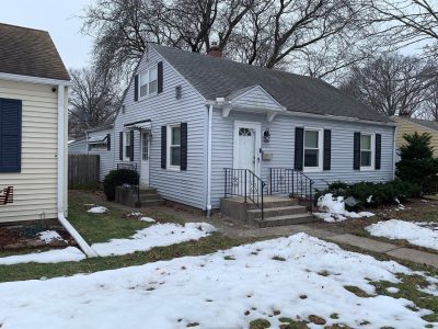 moline roofing installation - street view of gray ranch-style house, before