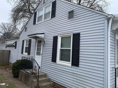 moline roofing installation - back of gray ranch-style house, before