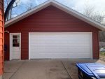 rock island siding replacement - front view of finished new red garage, after
