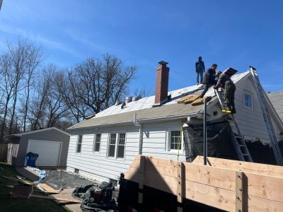 moline roofing replacement - contractors replacing old roof, during