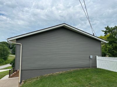 taylor ridge siding installation - new dark gray siding on side of garage, after