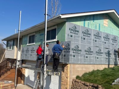 taylor ridge siding installation - contractors installing new siding layers, during