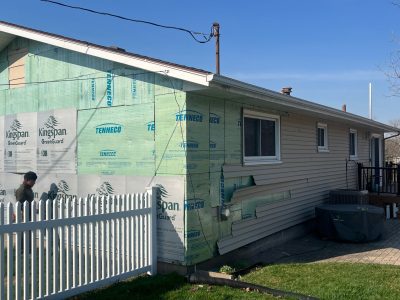 taylor ridge siding installation - new siding layers applied to house, during