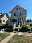 moline siding replacement - front view of two-story house with new light gray siding, after