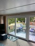 east moline patio door replacement - indoor side view of new glass patio doors, after