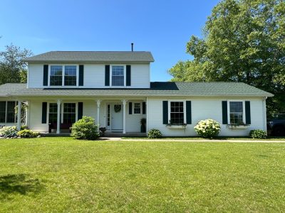 geneseo window installation - street view of white two-story house with new windows, after