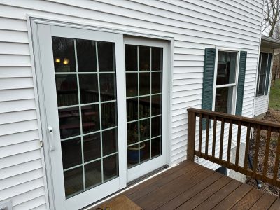 geneseo window installation - glass patio doors and deck, before