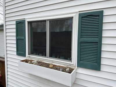 geneseo window installation - large window with flower box and teal shutters, before