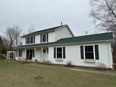 geneseo window installation - front view of two-story white house, before